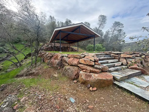 a backyard of a house with lots of green space