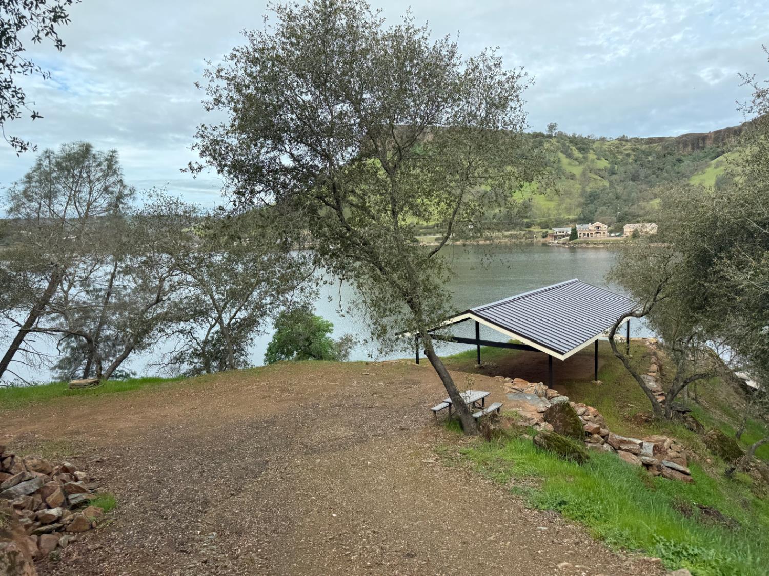 15000 Old O'Byrnes Ferry Road Jamestown, CA 95327 - Photo 7 of 62 a view of a lake with a mountain in the back