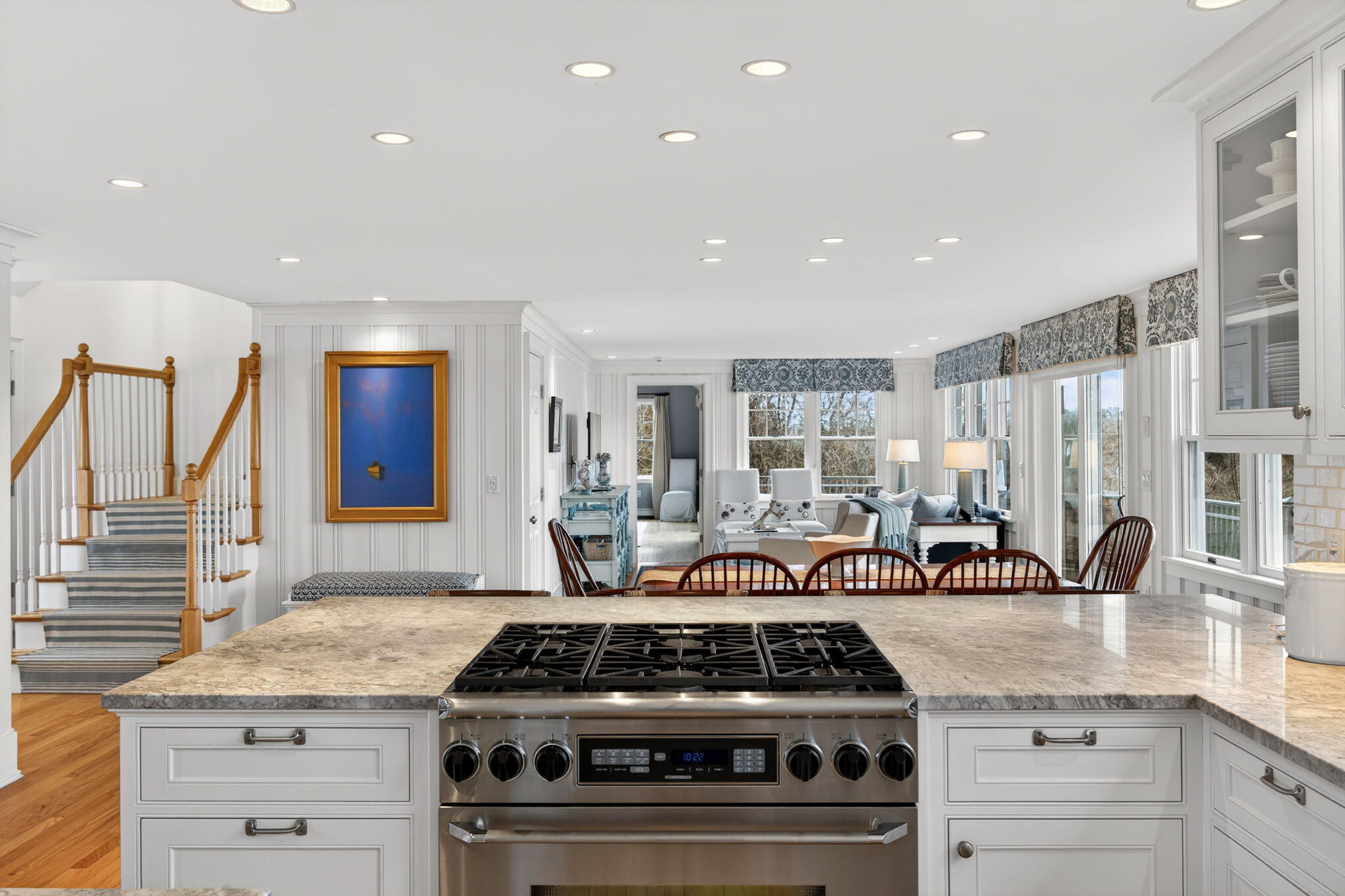 346 Morris Island Road Chatham, MA 02633 - Photo 13 of 33 a kitchen with a stove and white cabinets