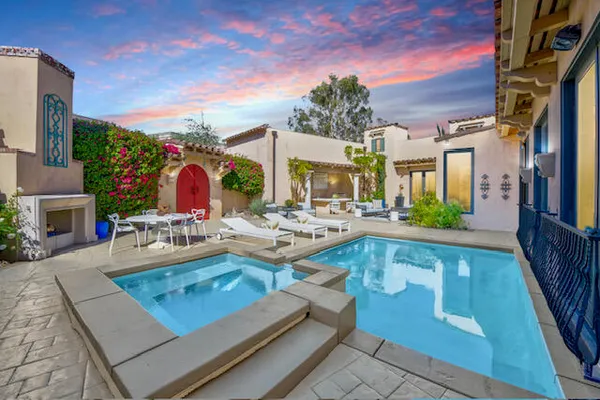 a view of swimming pool with outdoor seating
