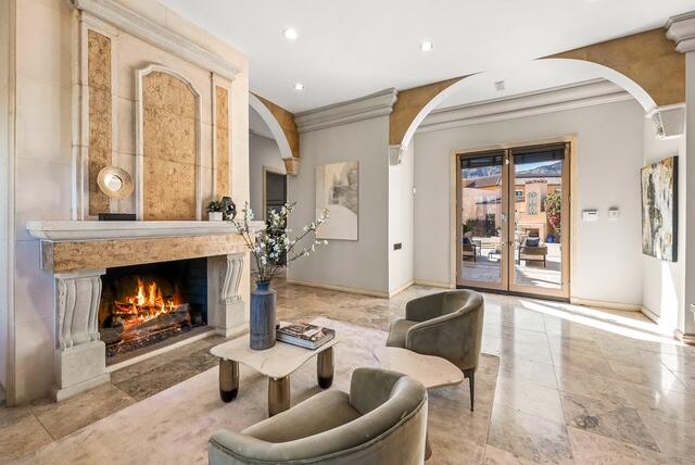 20 Vía Condotti Rancho Mirage, CA 92270 - Photo 12 of 40 a living room with furniture and a fireplace