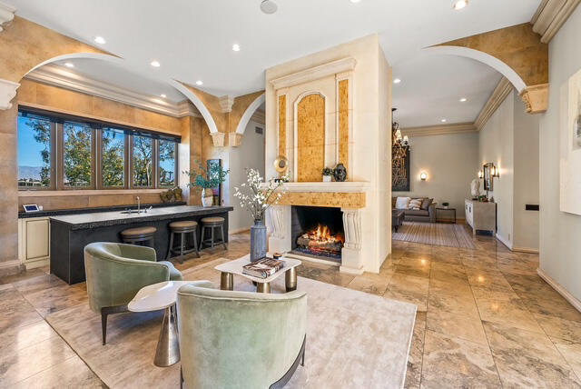 20 Vía Condotti Rancho Mirage, CA 92270 - Photo 13 of 40 a living room with furniture a fireplace and a table