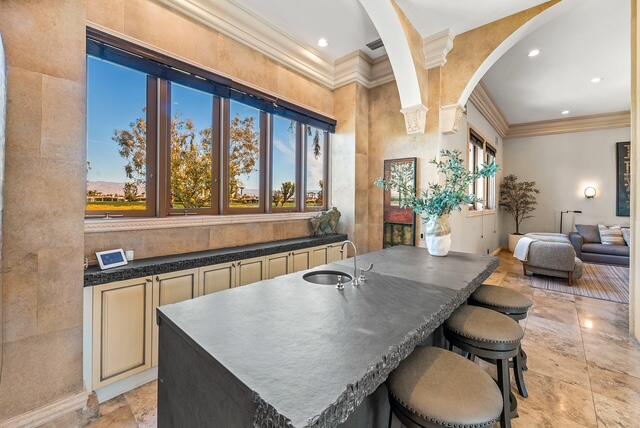 20 Vía Condotti Rancho Mirage, CA 92270 - Photo 15 of 40 a kitchen with a table chairs stove and wooden floor