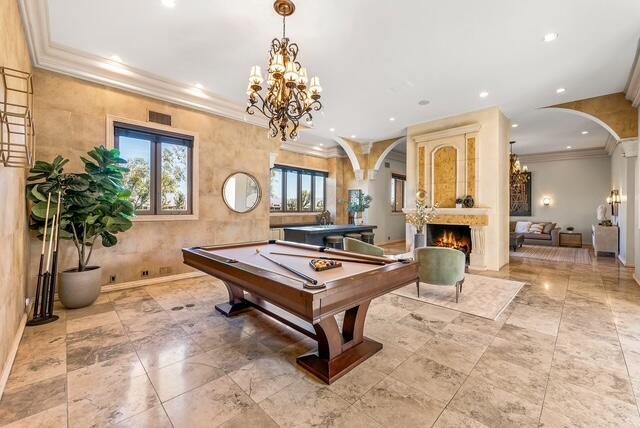 20 Vía Condotti Rancho Mirage, CA 92270 - Photo 16 of 40 a living room with furniture a chandelier and a chandelier