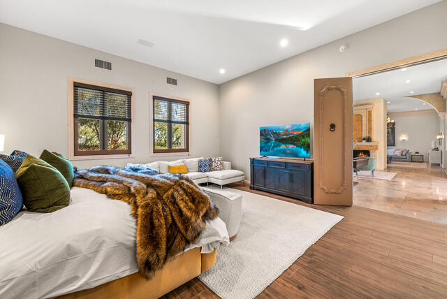 20 Vía Condotti Rancho Mirage, CA 92270 - Photo 22 of 40 a bedroom with a bed a dresser and a large mirror