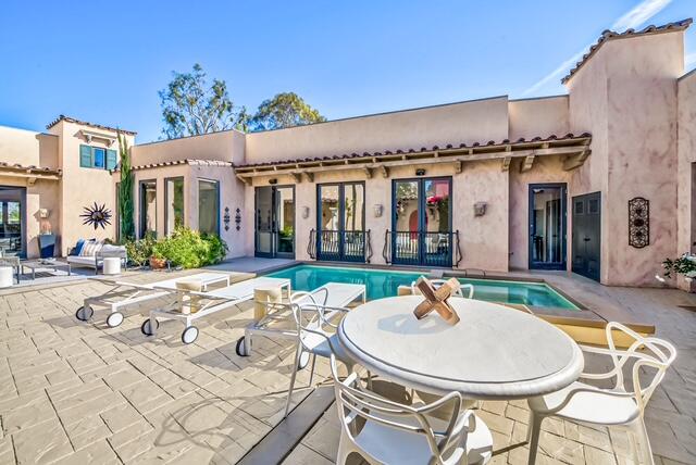 20 Vía Condotti Rancho Mirage, CA 92270 - Photo 37 of 40 a backyard of a house with table and chairs