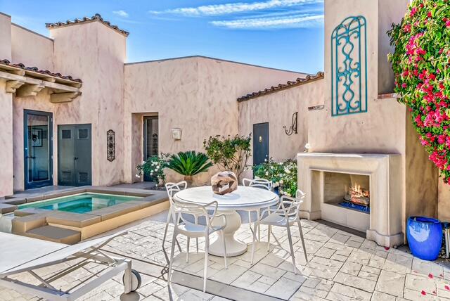 20 Vía Condotti Rancho Mirage, CA 92270 - Photo 39 of 40 a backyard of a house with table and chairs