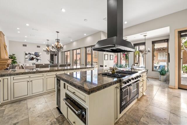 20 Vía Condotti Rancho Mirage, CA 92270 - Photo 8 of 40 a kitchen with stainless steel appliances granite countertop a stove and a sink
