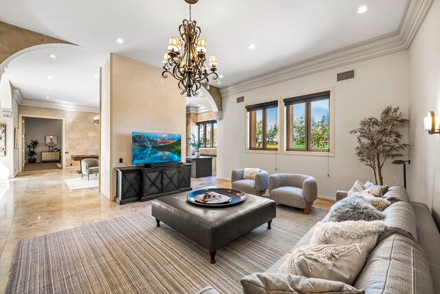 20 Vía Condotti Rancho Mirage, CA 92270 - Photo 10 of 40 a living room with furniture and a chandelier