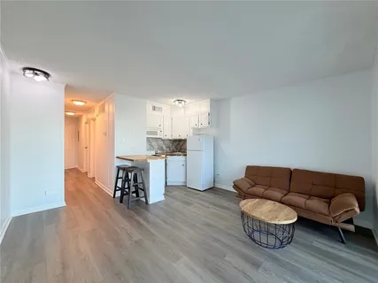 a view of a livingroom with furniture and wooden floor