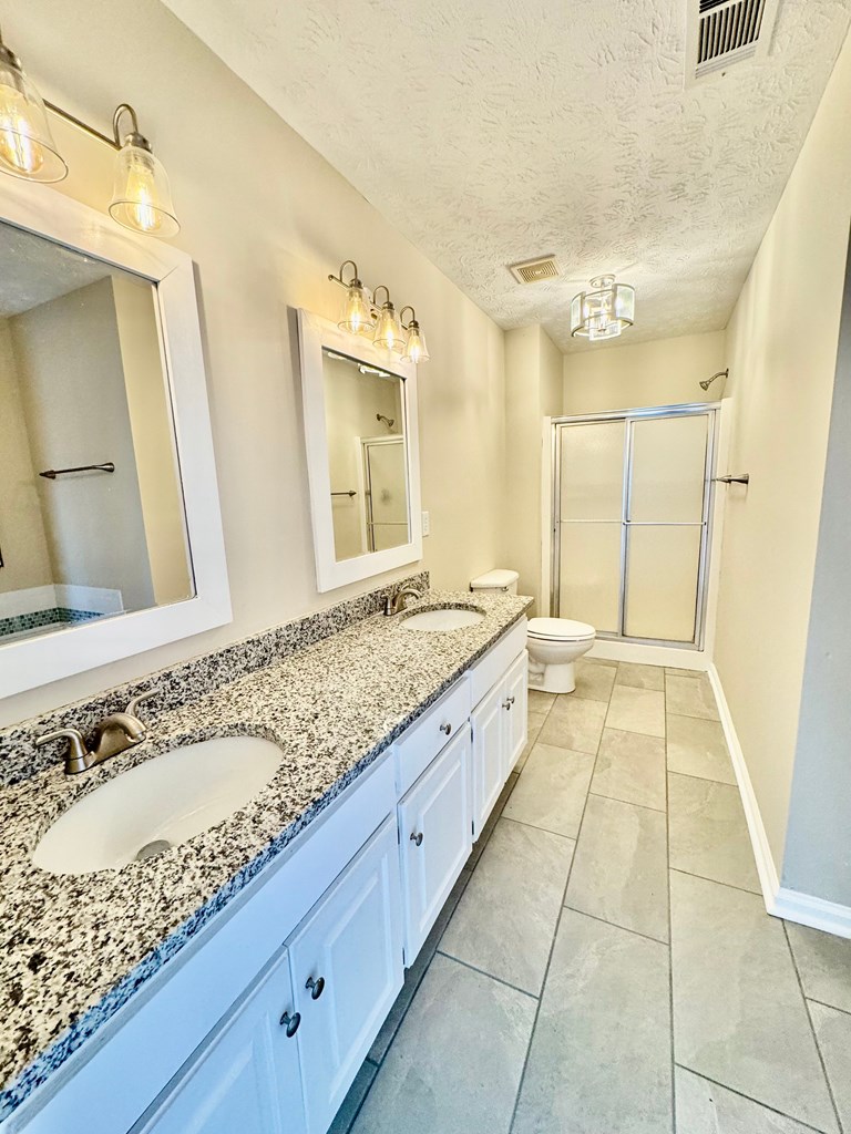 66 Ryan Loop Phenix City, AL 36869 - Photo 21 of 22 a bathroom with a sink and a mirror