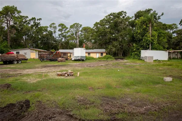 a backyard of a house with lots of green space