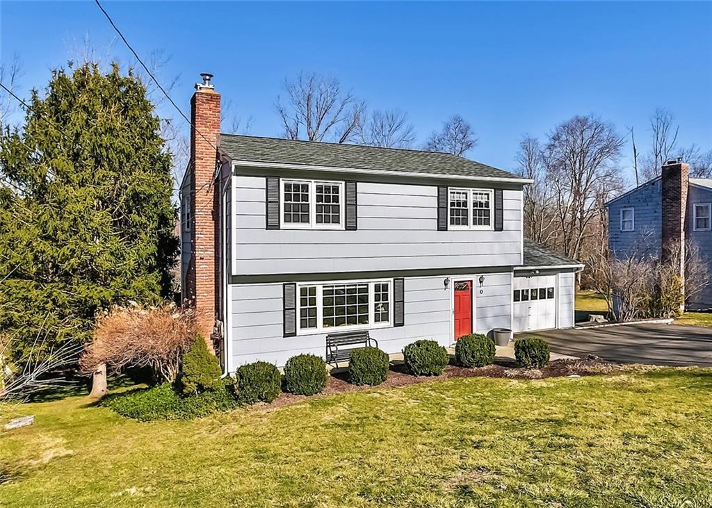 35 Marcardon Avenue Ridgefield, CT 06877 - Photo 1 of 1 a front view of a house with a yard