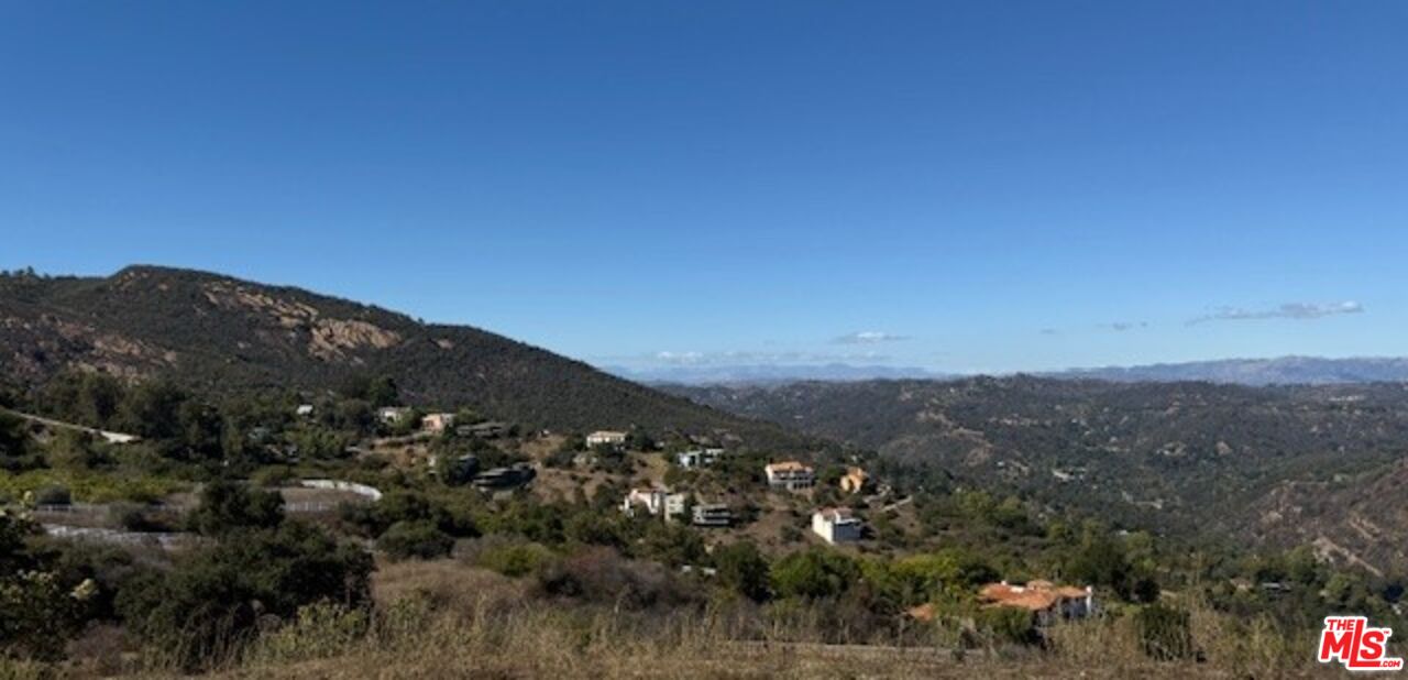 20266 Reigate Road Topanga, CA 90265 - Photo 5 of 5 a view of a city with lush green forest