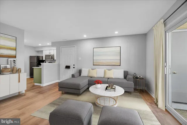 a living room with furniture and a table