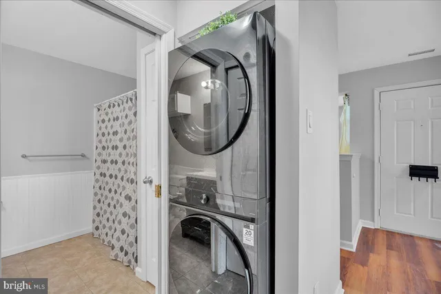 a view of a storage and utility room with washer and dryer