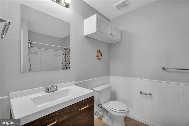 a bathroom with a shower curtain