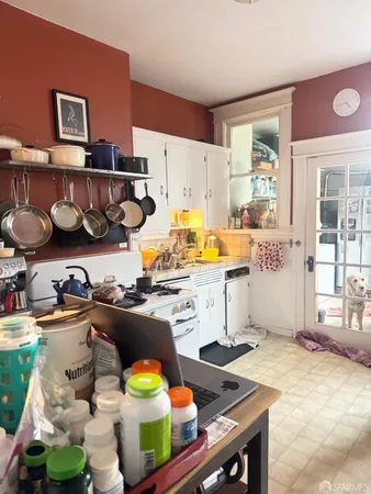 a kitchen with stainless steel appliances granite countertop a stove and a wooden cabinets