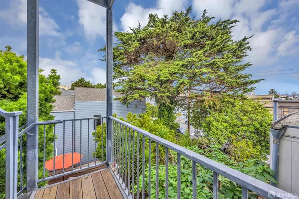a view of a balcony with a pot