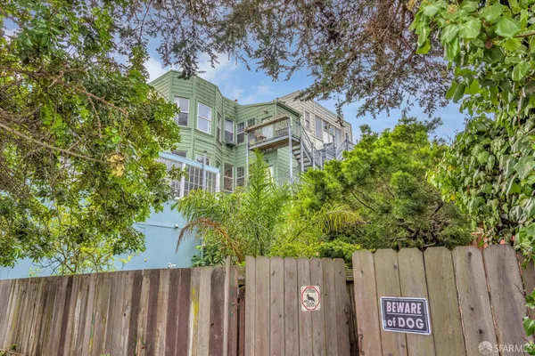 a view of a house with a tree