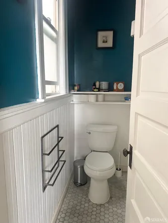 a bathroom with a toilet and a sink