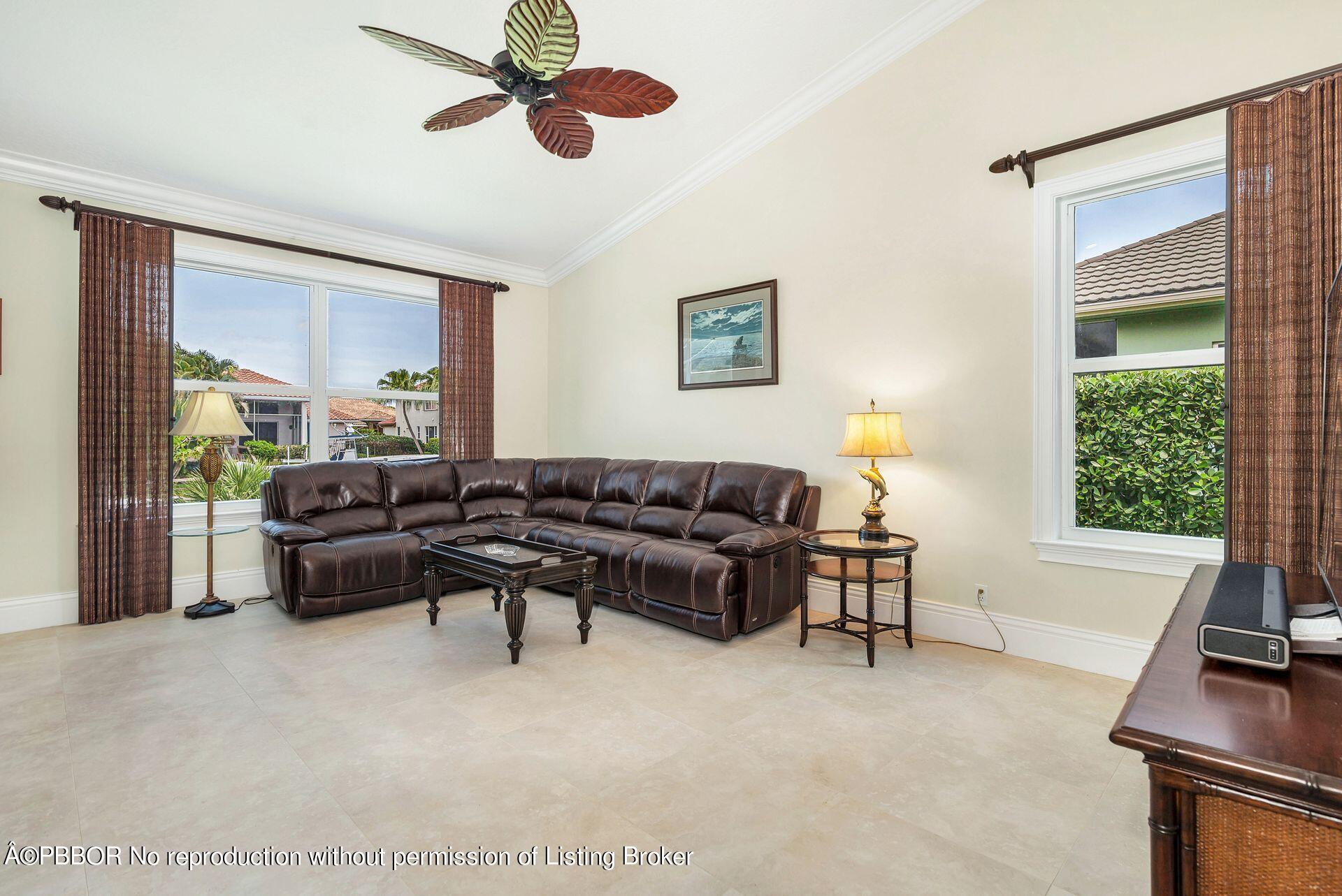 8774 Southeast Riverfront Terrace Tequesta, FL 33469 - Photo 13 of 45 a living room with furniture and a window