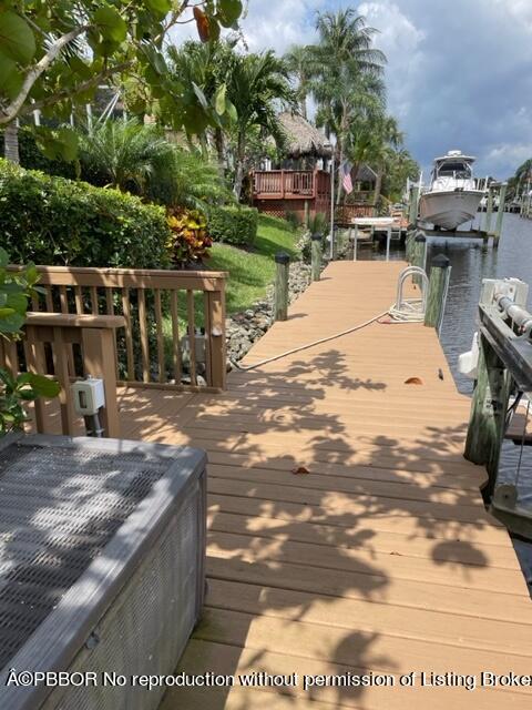 8774 Southeast Riverfront Terrace Tequesta, FL 33469 - Photo 15 of 45 a view of a backyard