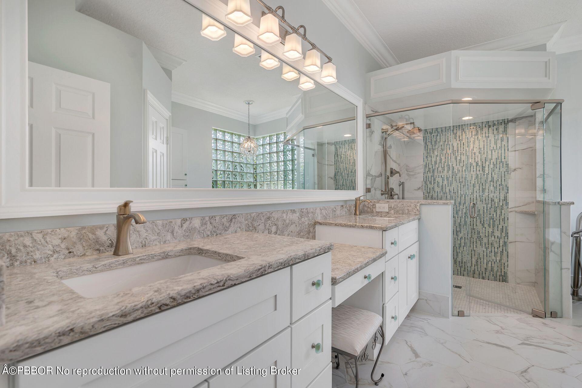8774 Southeast Riverfront Terrace Tequesta, FL 33469 - Photo 23 of 45 a bathroom with a granite countertop sink mirror and double