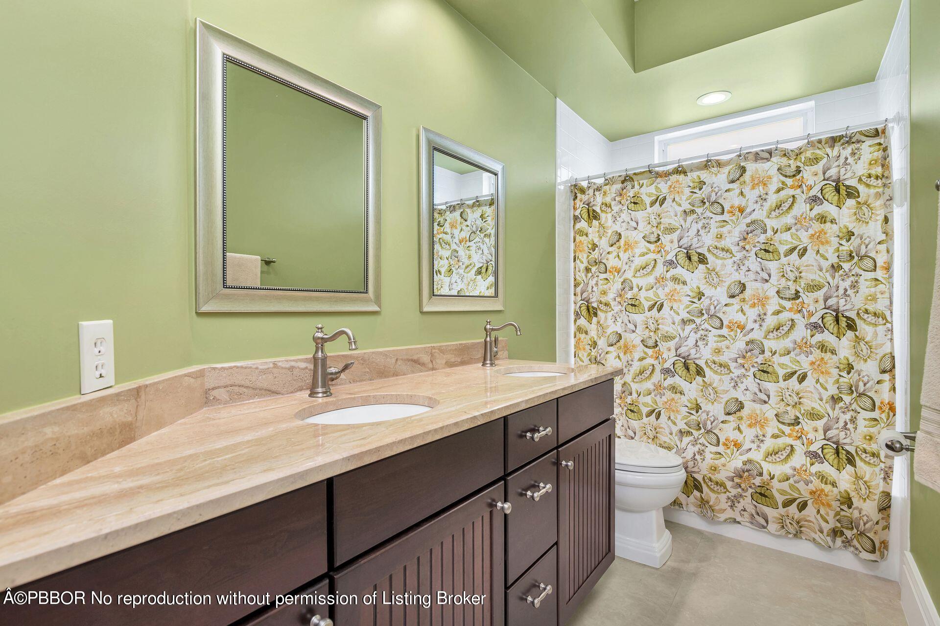 8774 Southeast Riverfront Terrace Tequesta, FL 33469 - Photo 28 of 45 a bathroom with a sink and a mirror