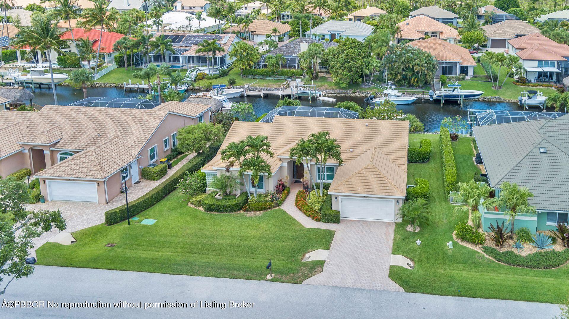 8774 Southeast Riverfront Terrace Tequesta, FL 33469 - Photo 40 of 45 an aerial view of house with yard swimming pool and outdoor seating