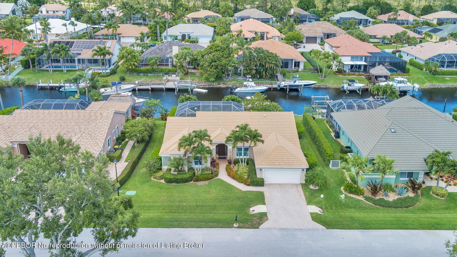 8774 Southeast Riverfront Terrace Tequesta, FL 33469 - Photo 41 of 45 an aerial view of a house with outdoor space and lake view