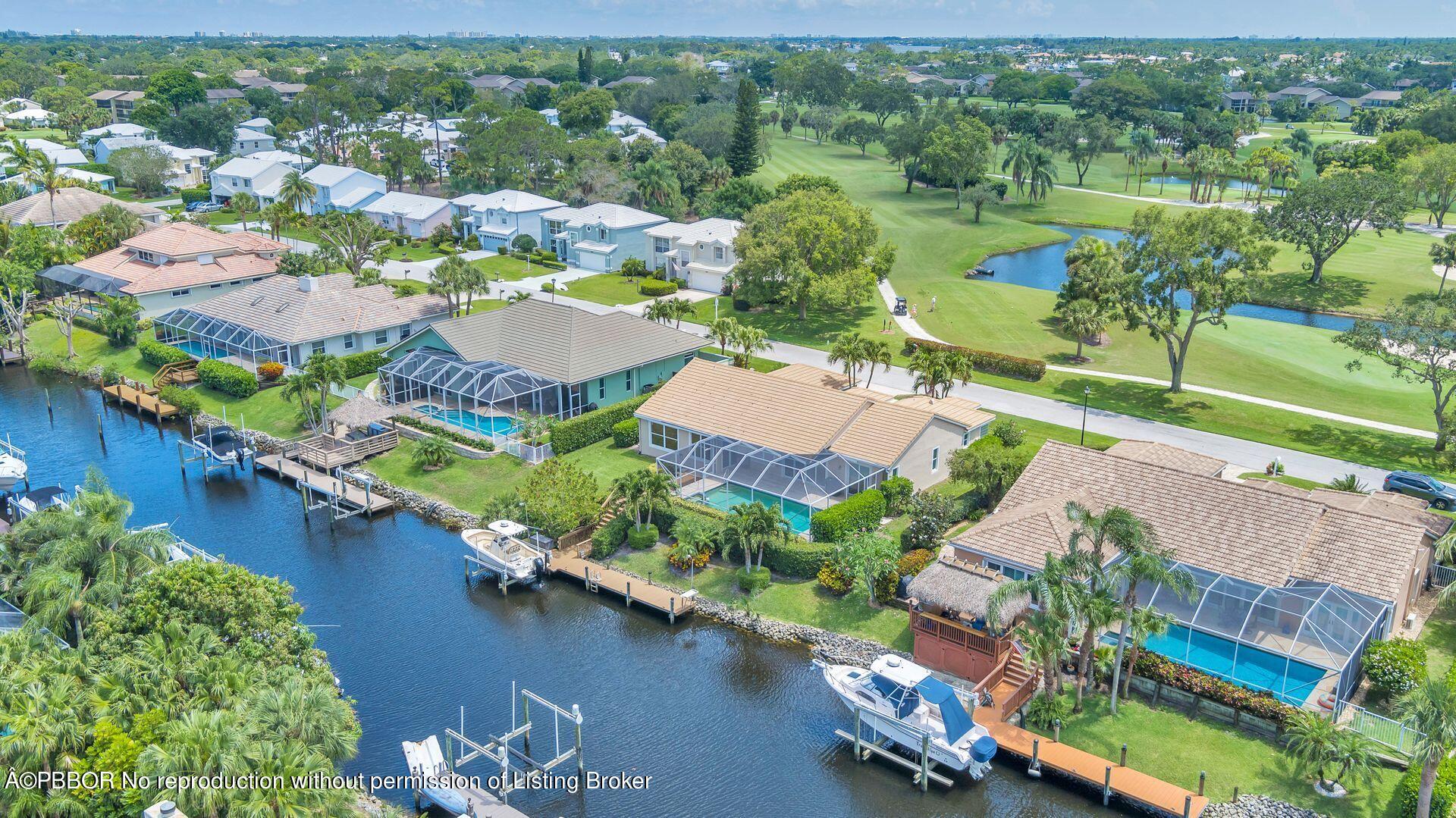 8774 Southeast Riverfront Terrace Tequesta, FL 33469 - Photo 44 of 45 an aerial view of residential houses with outdoor space and river view