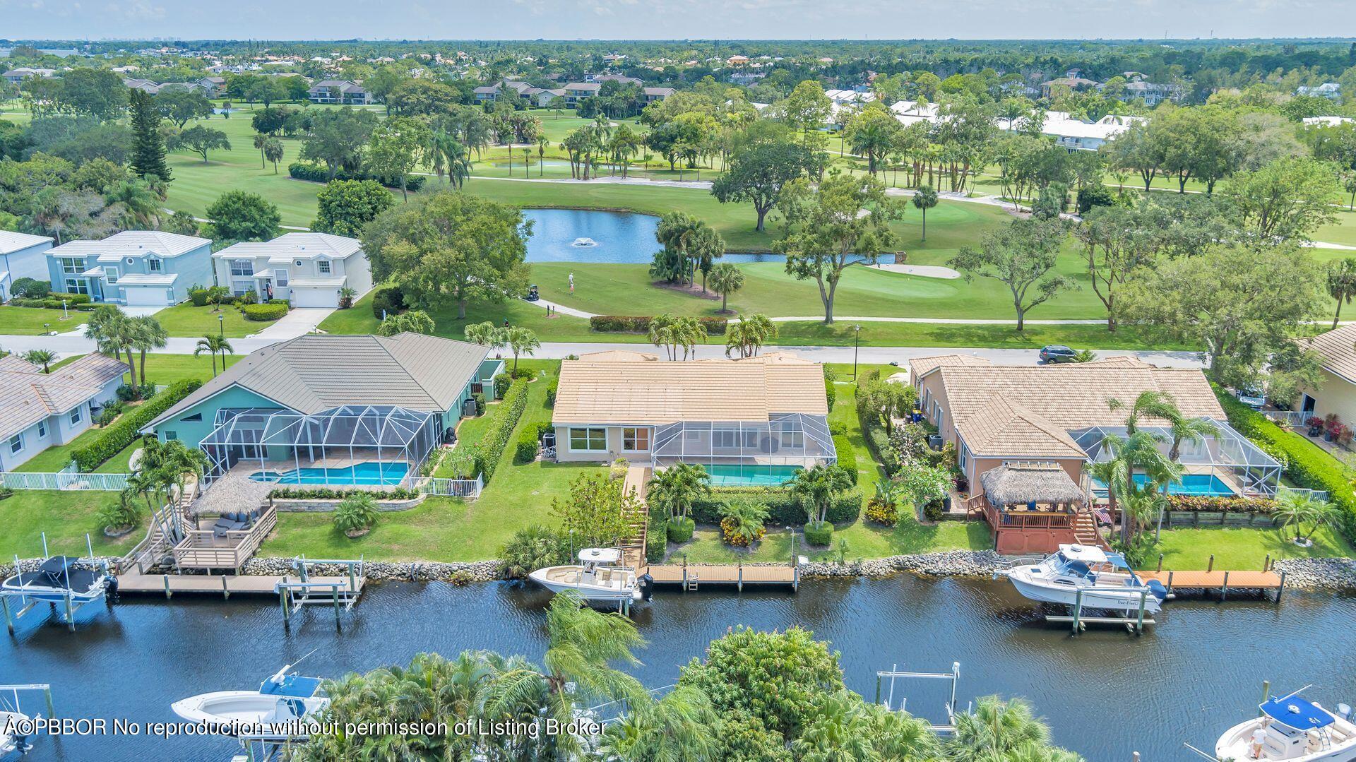 8774 Southeast Riverfront Terrace Tequesta, FL 33469 - Photo 45 of 45 an aerial view of residential houses with outdoor space and lake view