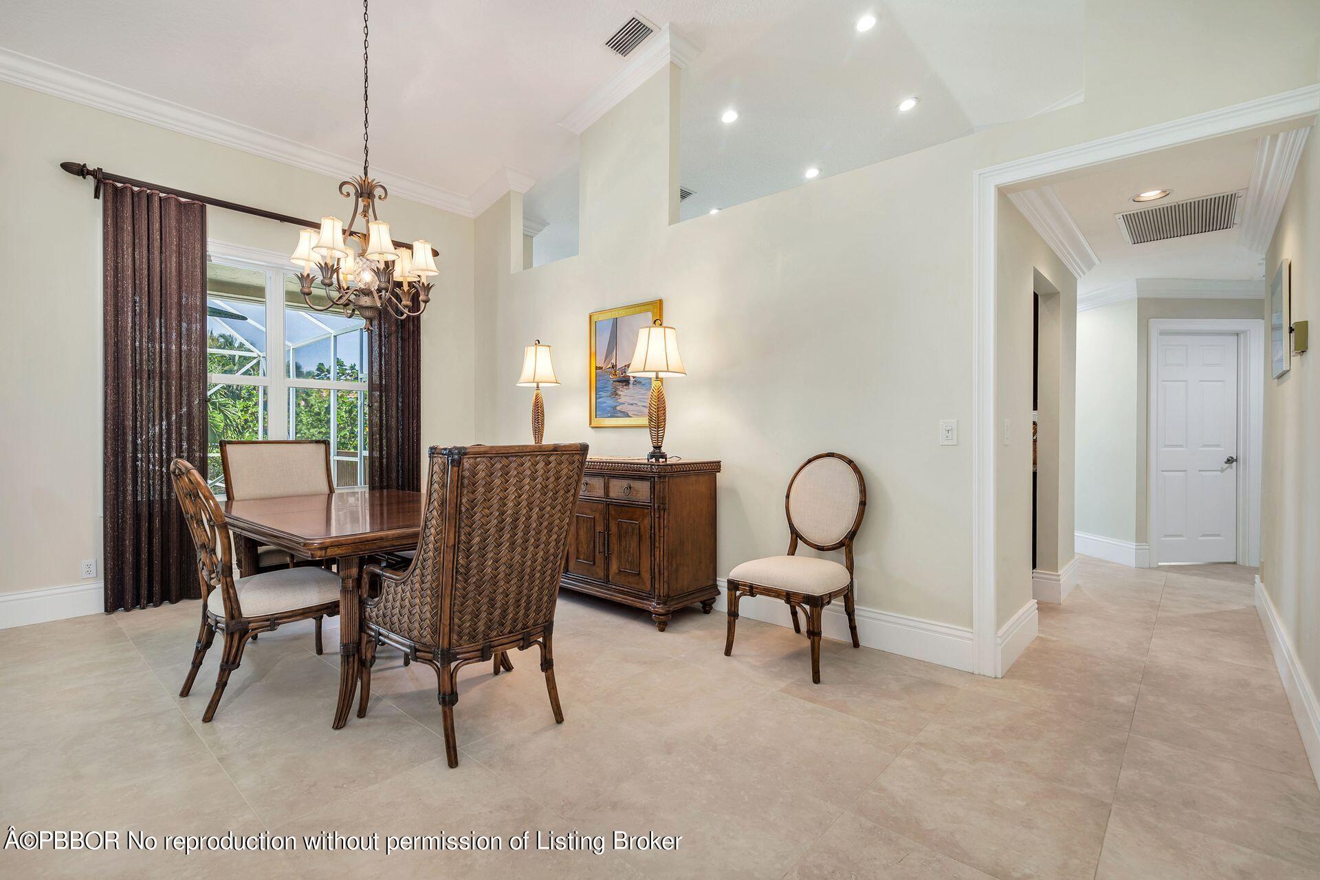 8774 Southeast Riverfront Terrace Tequesta, FL 33469 - Photo 6 of 45 a view of a livingroom with furniture and a chandelier