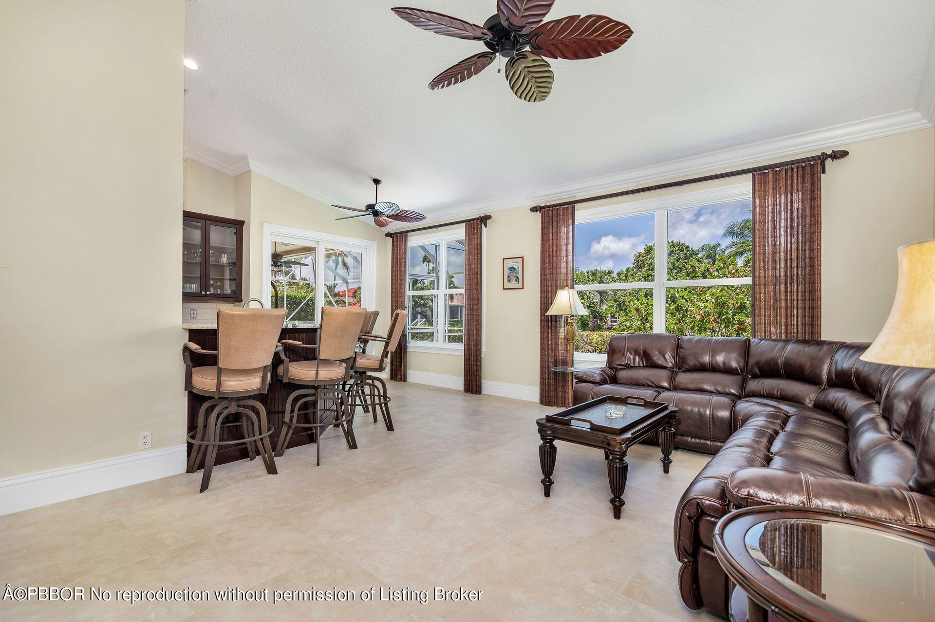 8774 Southeast Riverfront Terrace Tequesta, FL 33469 - Photo 7 of 45 a living room with furniture and a window