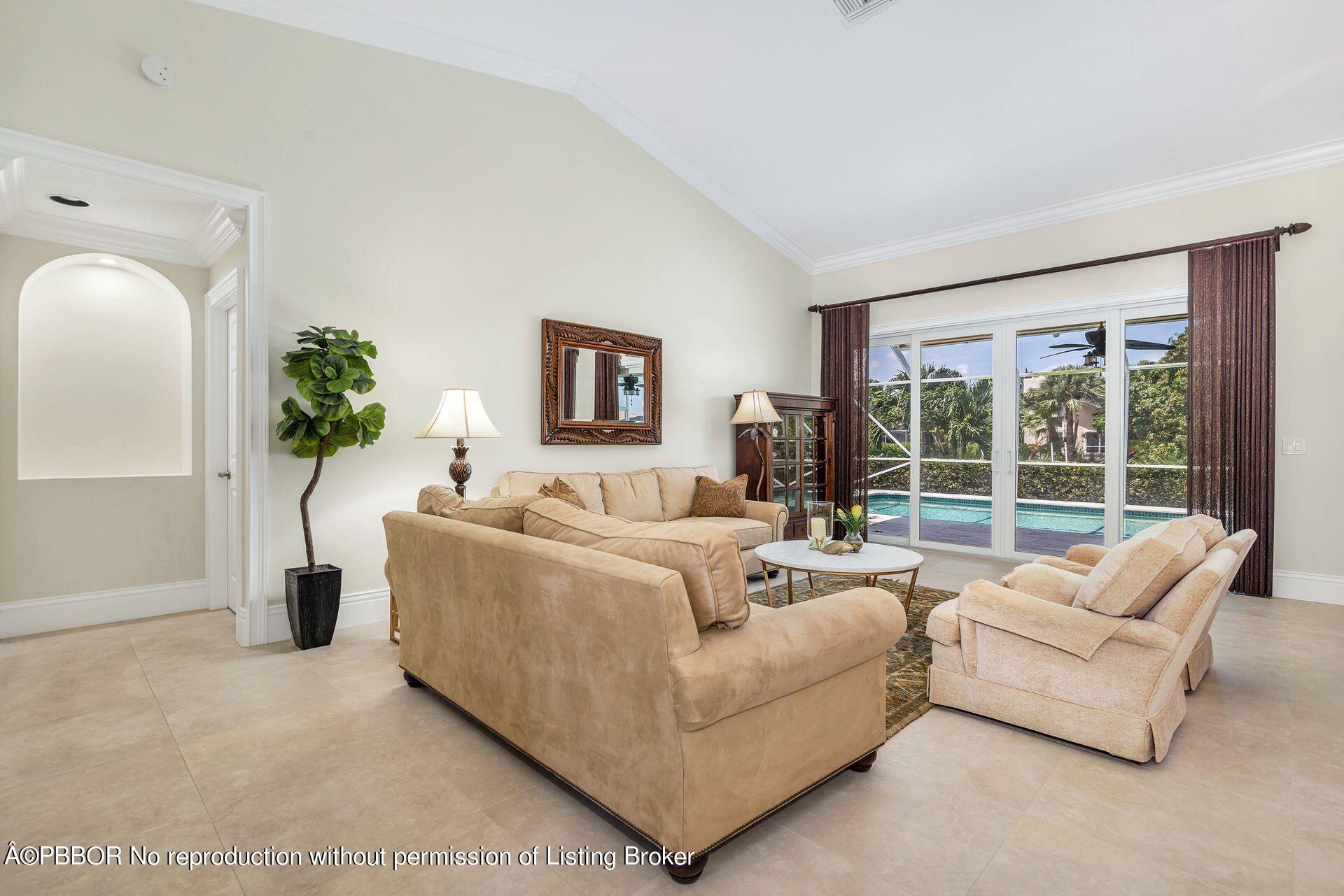 8774 Southeast Riverfront Terrace Tequesta, FL 33469 - Photo 9 of 45 a living room with furniture and a large window