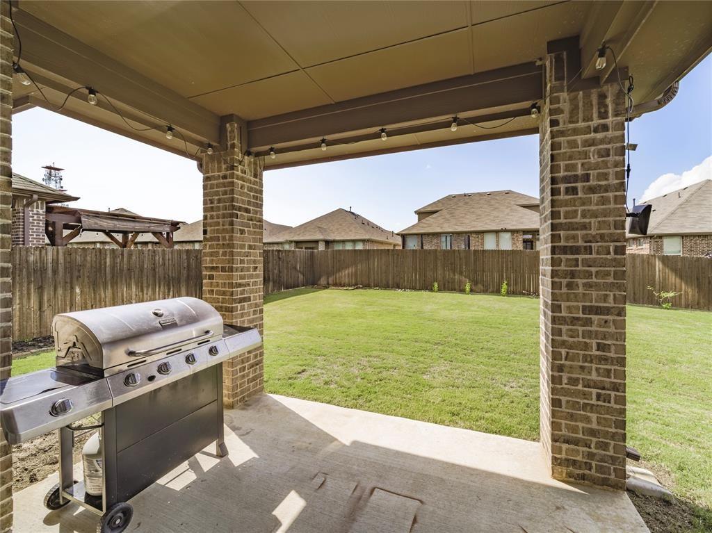 1809 Spinnaker Drive Denton, TX 76210 - Photo 14 of 18 a view of a floor to ceiling window and a yard