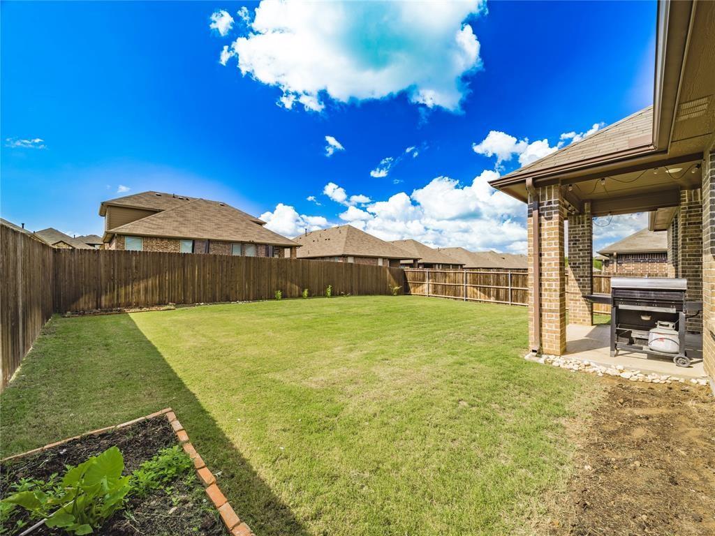 1809 Spinnaker Drive Denton, TX 76210 - Photo 15 of 18 a view of an house with backyard and patio