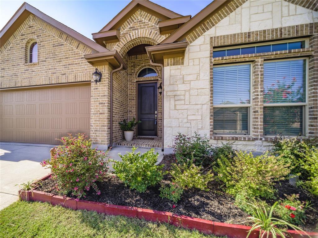 1809 Spinnaker Drive Denton, TX 76210 - Photo 2 of 18 a view of a house with potted plants