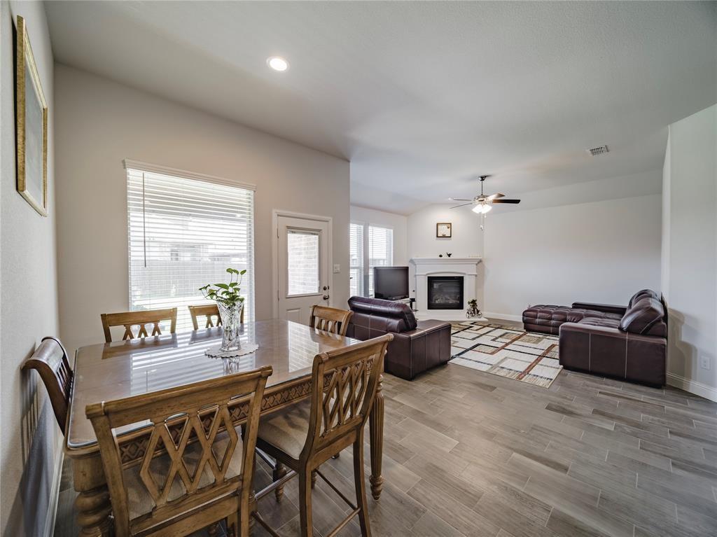 1809 Spinnaker Drive Denton, TX 76210 - Photo 10 of 18 a living room with fireplace furniture and a large window