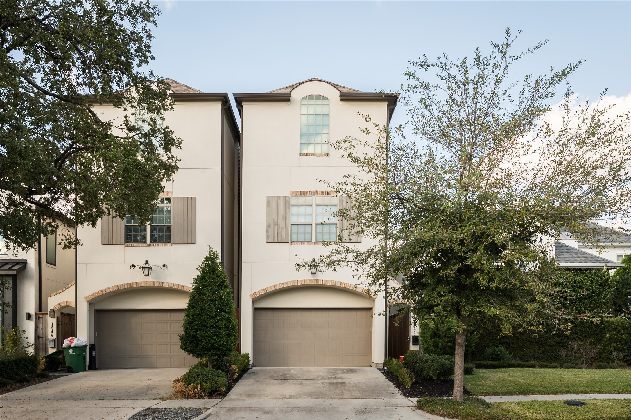 1944 Portsmouth Street Houston, TX 77098 - Photo 1 of 36 a front view of a house with trees
