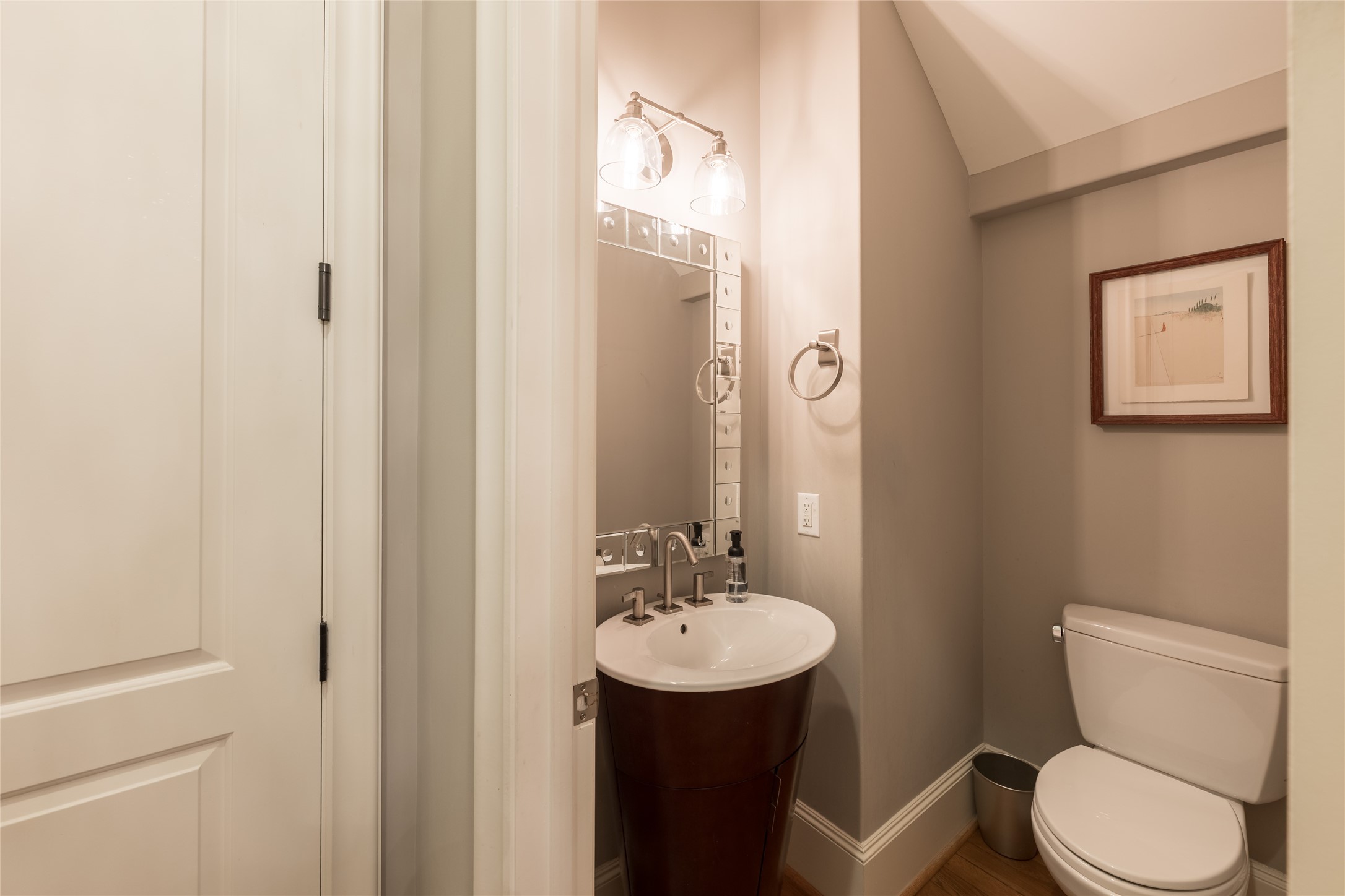 1944 Portsmouth Street Houston, TX 77098 - Photo 14 of 36 a bathroom with a toilet a sink and mirror