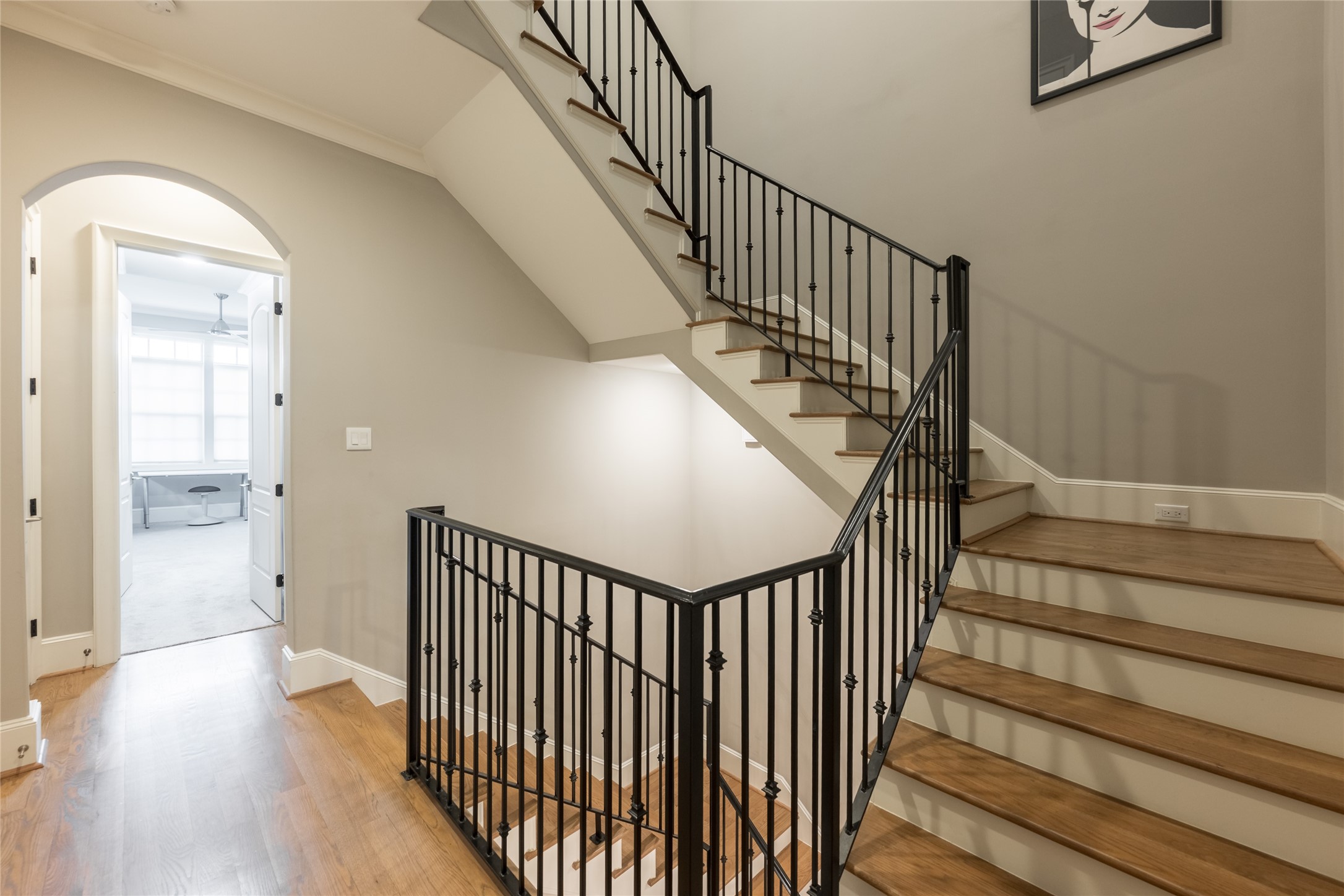 1944 Portsmouth Street Houston, TX 77098 - Photo 15 of 36 a view of staircase with wooden floor and white walls