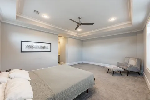 a white bath tub sitting next to a white toilet