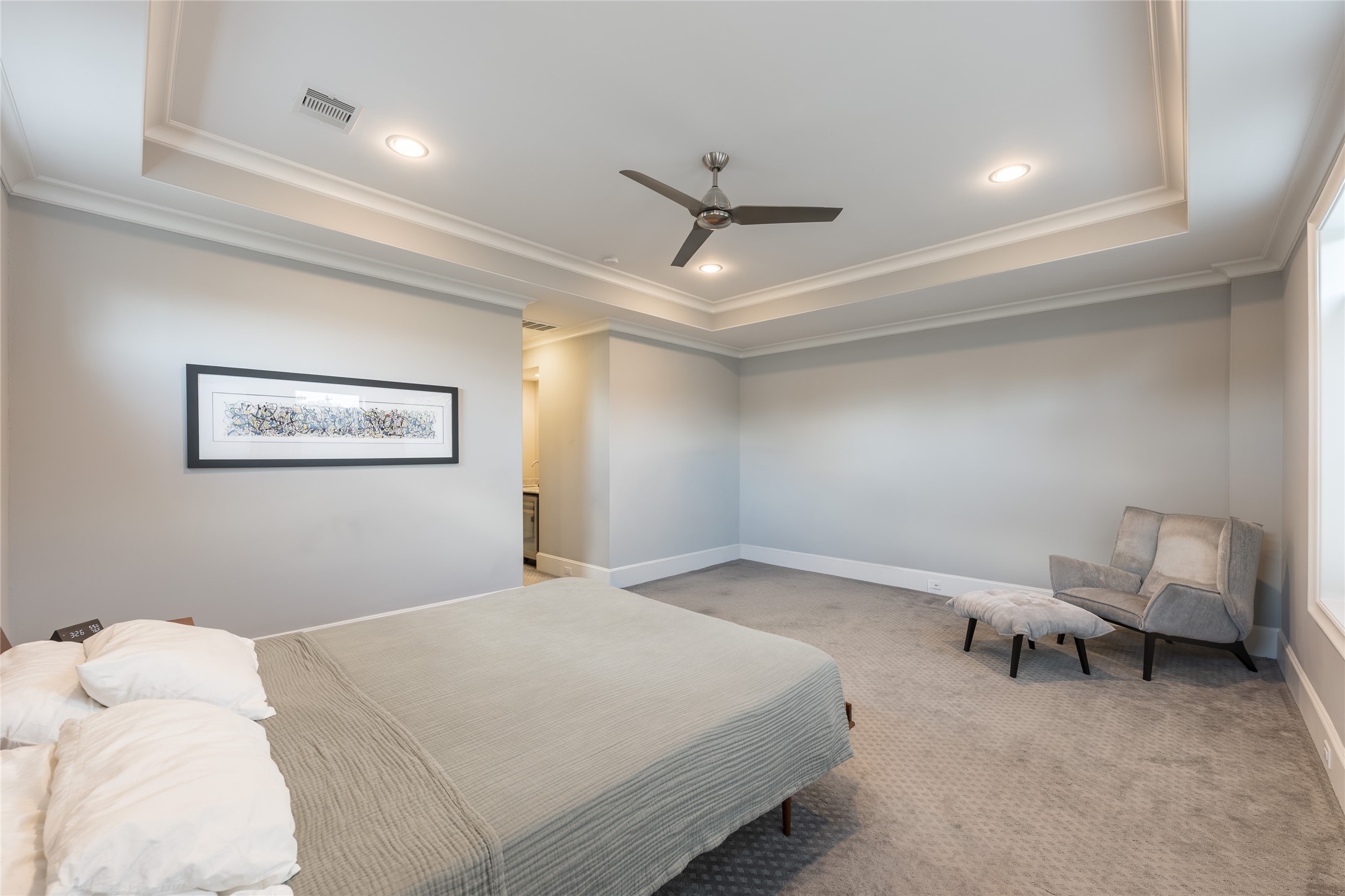 1944 Portsmouth Street Houston, TX 77098 - Photo 17 of 36 a bedroom with a bed and a ceiling fan