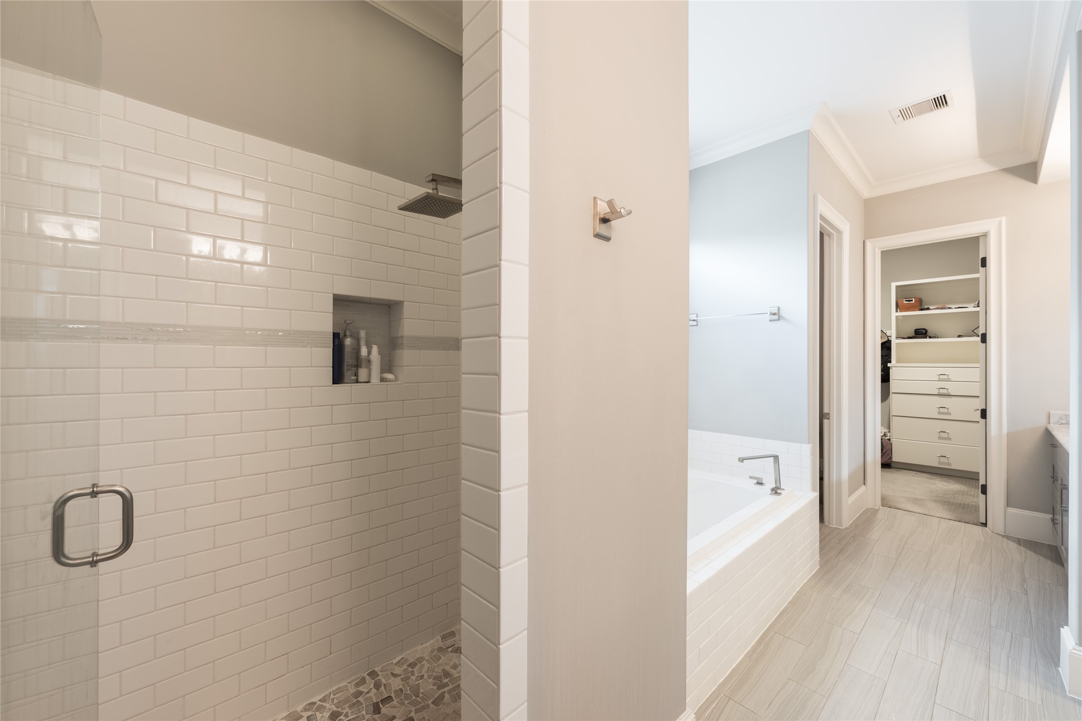 1944 Portsmouth Street Houston, TX 77098 - Photo 19 of 36 a bathroom with a tub shower vanity and a sink