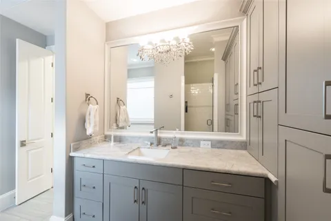 a bathroom with a sink a vanity and a mirror