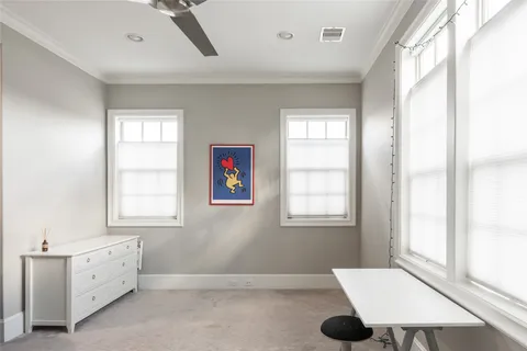 a bathroom with a granite countertop sink toilet a mirror and shower curtain