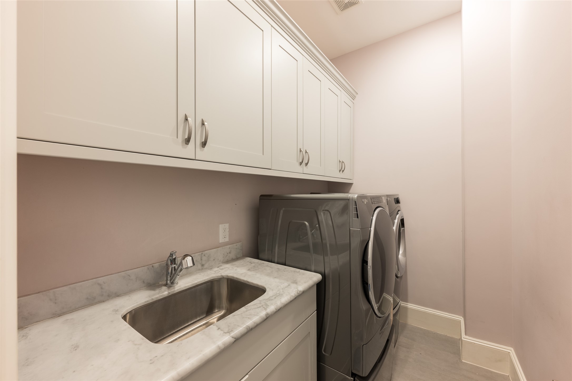 1944 Portsmouth Street Houston, TX 77098 - Photo 27 of 36 a kitchen with a sink and cabinets