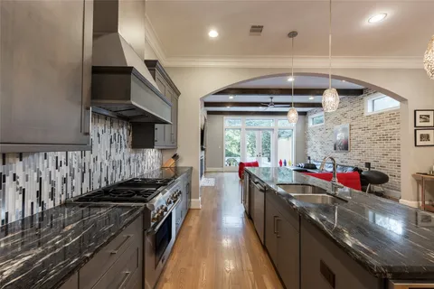 a kitchen with granite countertop lots of counter top space and stainless steel appliances